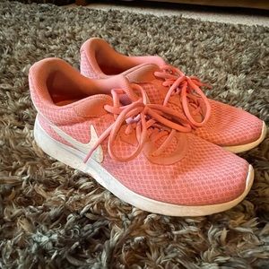 Coral Nike tennis shoes